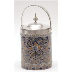 A Doulton Lambeth cylindrical biscuit barrel by Frank Butler with leaf scroll design and silver p...