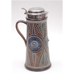 A Doulton Lambeth tapered cylindrical tankard with silver lid and geometric leaf and floral decor...