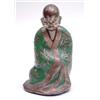 Image 1 : A 19th century Oriental brass and enamel figure of a seated buddhist priest, wearing a green flor...