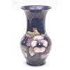 Image 1 : A Moorcroft pansy pattern vase of bellied form with flared rim, blue ground, 9.5ins £300-400...