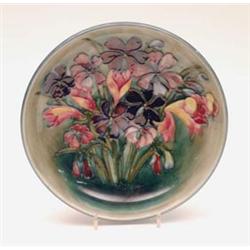 A Moorcroft fuschia pattern bowl on a green blue ground, diameter 10.5ins £300-500...