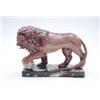 Image 1 : An early 19th century Staffordshire model of a lion painted in an overglaze enamel russet colour,...