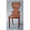 Image 1 : A William IV mahogany hall chair with scroll carved back and solid seat, on turned tapered legs £...