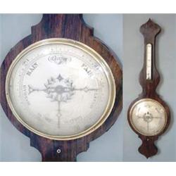 A Victorian rosewood veneered wheel barometer with silvered barometer and thermometer dials 3ft 4...