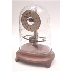 An early electric Bulle Patent mantel clock with skeletal lacquered brass mechanism, under glass...