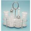Image 1 : An Edwardian plated cruet stand fitted with 6 cut glass condiment bottles £150-200...
