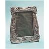 Image 1 : An Edwardian silver photograph frame of Art Nouveau design decorated with a goose girl and flower...
