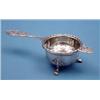 Image 1 : A George V silver christening mug and a silver tea strainer and stand £180-250...