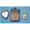 Image 1 : A late Victorian heart shaped silver vesta case, a cheroot cutter and a notecase £80-120...