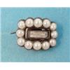 Image 1 : A small Regency gold, black enamel and split pearl memorial brooch with central plaited hair comp...
