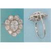 Image 1 : A diamond set dress ring, the central pear shaped stone bordered by 9 millegrain set old brillian...