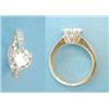 Image 1 : A solitaire diamond ring claw set in 18ct gold and platinum, the tapered shoulders each set 5 dia...