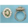 Image 1 : An 18ct white gold dress ring set with a central marquise cut diamond bordered by 8 round cut eme...