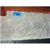 Image 1 : Approx 6F by 8F off white shag area rug