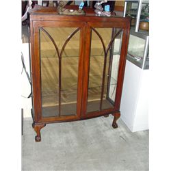 Antique glass front curio cabinet with carved ball