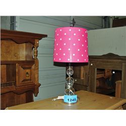 Table lamp with pink polkadot shade