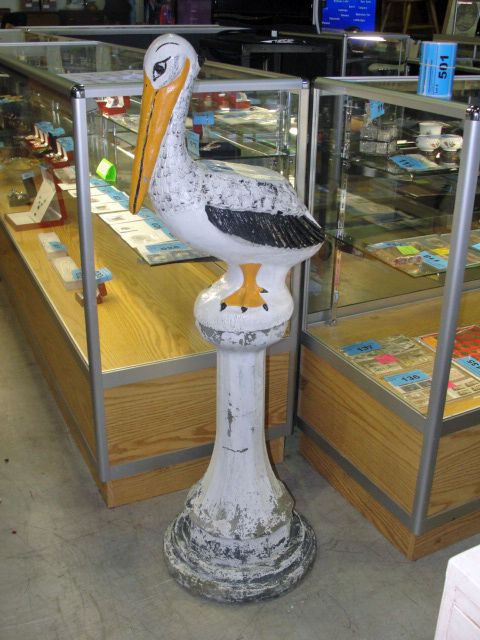 Cement pelican on pedistol yard ornament