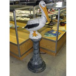Cement pelican on pedistol yard ornament