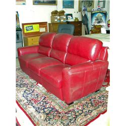 Red leather contemporary sofa - tear present