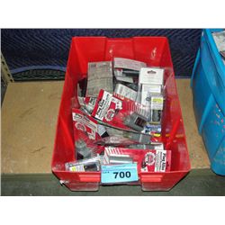 Red plastic storage bin filled with new plug alive