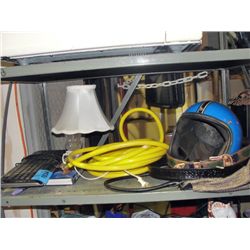 Shelf lot of misc; yellow water hose, motorcycle