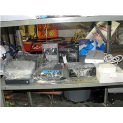 Shelf lot of assorted electronics; car stereos,