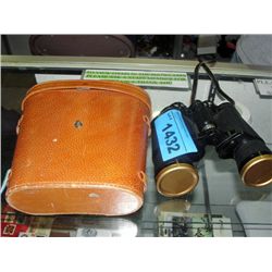 Pair of vintage binoculars with leather case