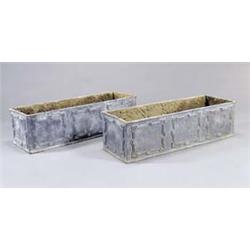 A pair of lead rectangular jardinieres, each with moulded panels to the sides, 28 high x 33 diame...