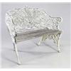 Image 1 : A Victorian iron garden bench cast overall with interlaced fern, with slatted wood seat on natura...