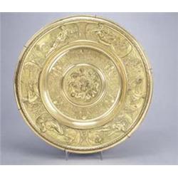 A late 19th century Elkington brass electroform round charger with reclining classical females, e...