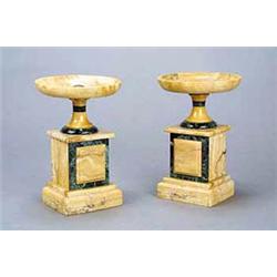 A pair of Continental yellow and green marble tazzae, each with a shallow dish and a round foot,...