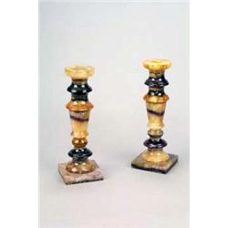 A pair of Derbyshire Blue John candlesticks, each of sectional turned tapering form on a square b...