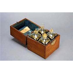An early 19th century oak box, the hinged lid enclosing a mirrored section of four continental sq...