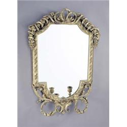 A mid 19th century gilt gesso girandole, the crest with garlands of flowers and ribbons, the fram...