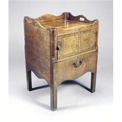 A George III mahogany tray top night commode, the wavy gallery with pierced handles, above a cros...