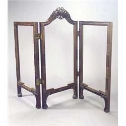 A 19th century Continental walnut three fold glazed screen, the central arched leaf carved with a...