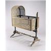 Image 1 : A George IV mahogany child's cradle, with caned arched hood and sides and a slatted base, the tur...