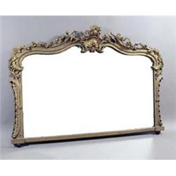 A Victorian gilt overmantel, the serpentine crest with foliate and 'C' scrolls and garlands of fl...