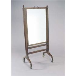 A George IV mahogany and crossbanded rectangular cheval mirror, the rising and adjustable mirror...