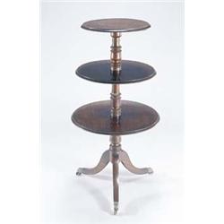 A George IV mahogany three tier dumb waiter, each graduated tier with a moulded edge and two drop...