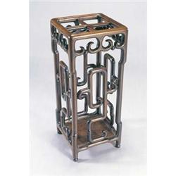 A Chinese huang huali stick stand with four divisions, the sides carved with stylized clouds, 74...