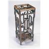 Image 1 : A Chinese huang huali stick stand with four divisions, the sides carved with stylized clouds, 74...