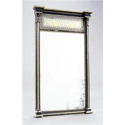An early 19th century ebonised and gilt overmantel mirror, the inverted breakfront cornice above...