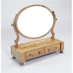 A George IV mahogany and boxwood strung dressing table mirror, the crossbanded oval plate on shap...