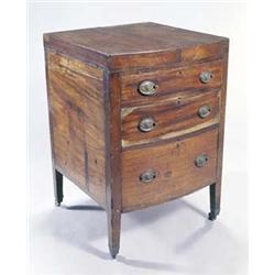 A late George III mahogany bowfront enclosed washstand, the double hinged top enclosing a mahogan...