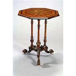 A Victorian walnut octagonal table, the top with a parquetry stylized star and a moulded edge, on...