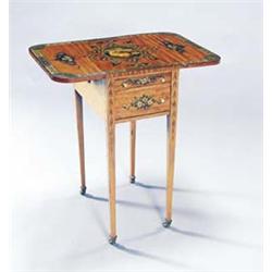 A Victorian Sheraton Revival painted satinwood drop leaf work table, the rectangular top with rou...