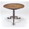 Image 1 : A mid 18th century walnut round tilt top table, on a birdcage and baluster turned column and thre...