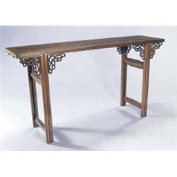 A Chinese huang huali rectangular altar type table, the cleated top with a reeded edge, on straig...