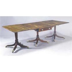 A mahogany and ebony strung rectangular three pillar dining table, the top crossbanded and with b...